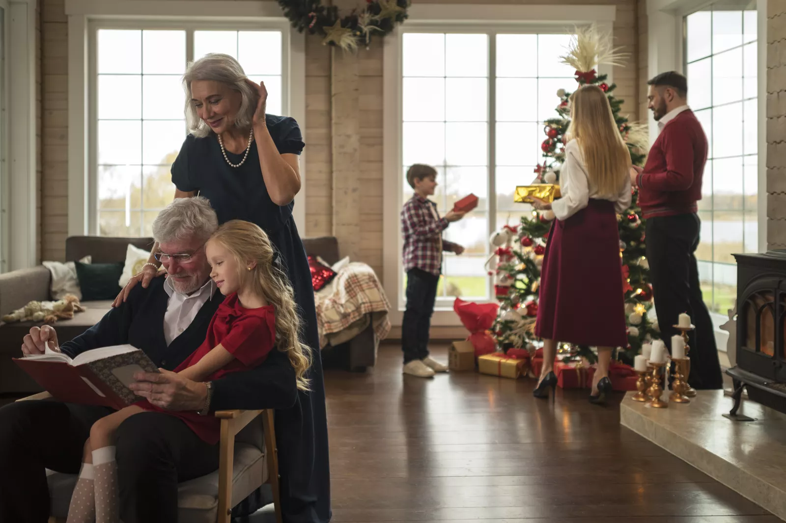 Family enjoying a festive Christmas evening together at home